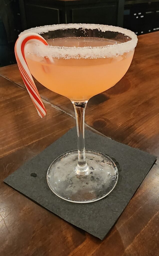 Candy cane cocktail in a coup glass